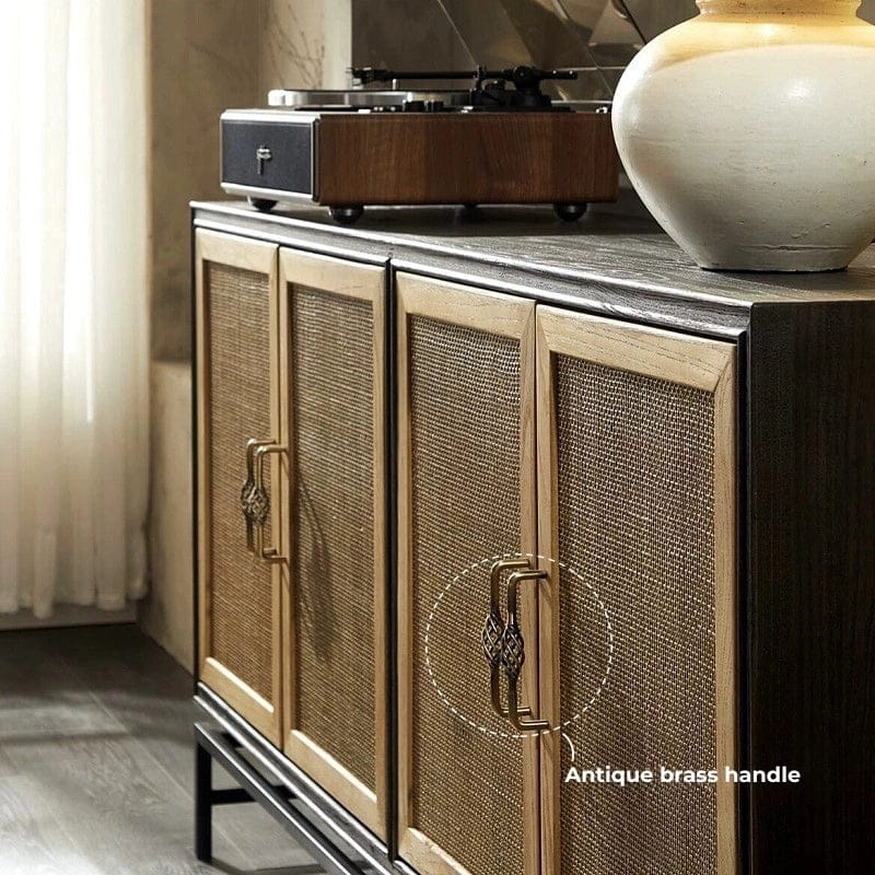 antique_brass_handle_on_rattan_cabinet_door.jpg Antique brass handle on a