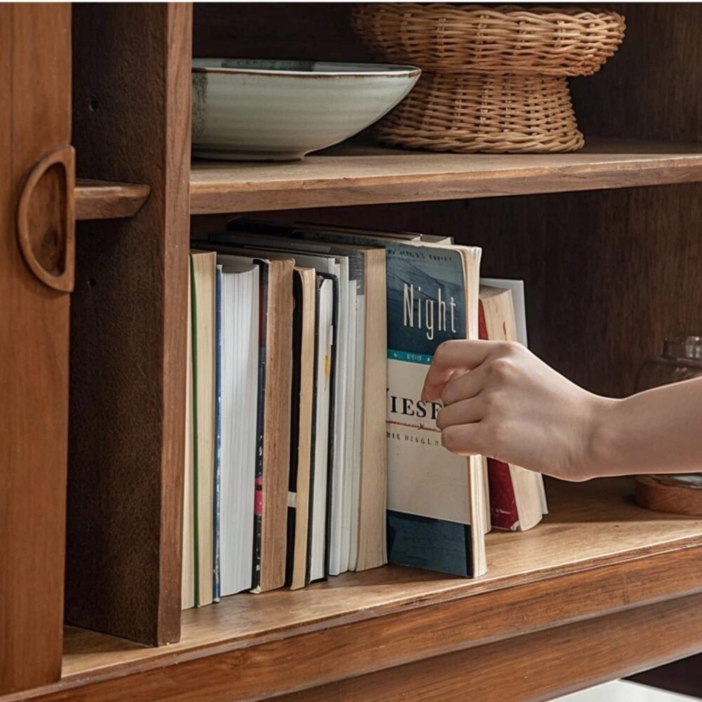 Hand pulling book from a