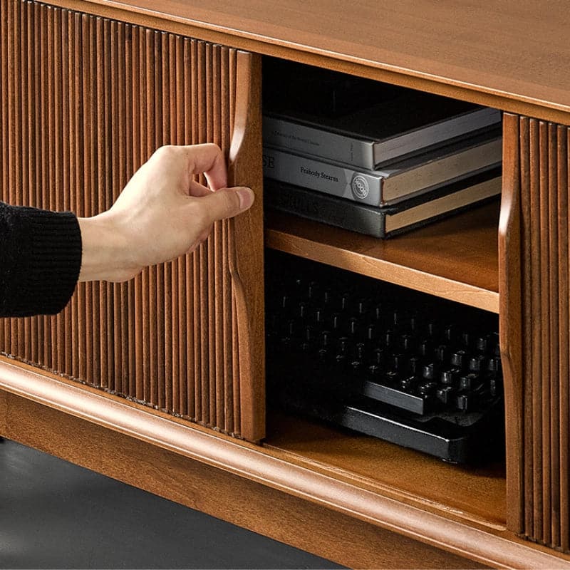 Hand sliding a tambour door