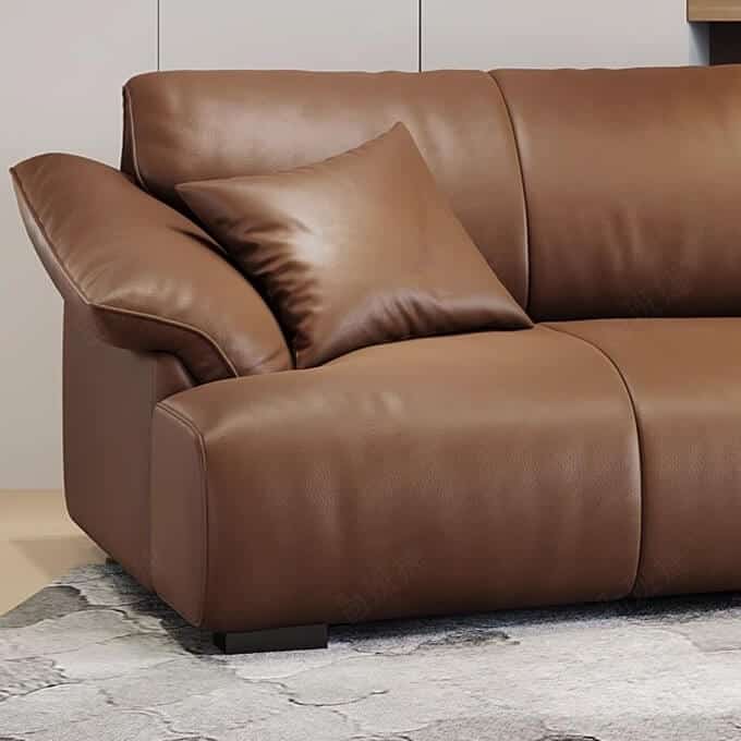 Brown leather curved sofa